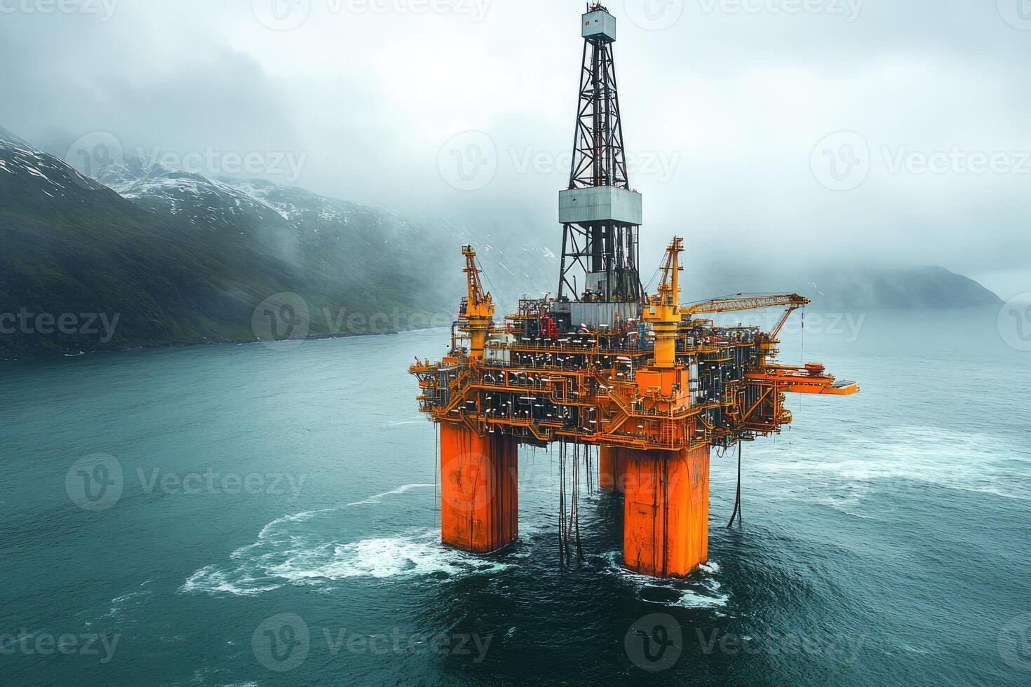 Offshore oil rig extracting petroleum near snowy mountain in the arctic ocean. . photo