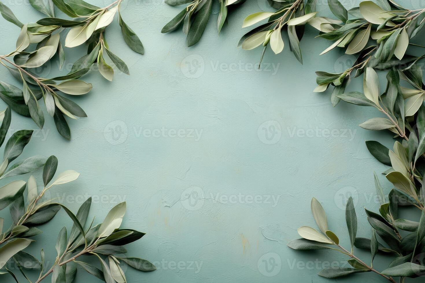 Olive branches creating a frame on a textured turquoise background photo