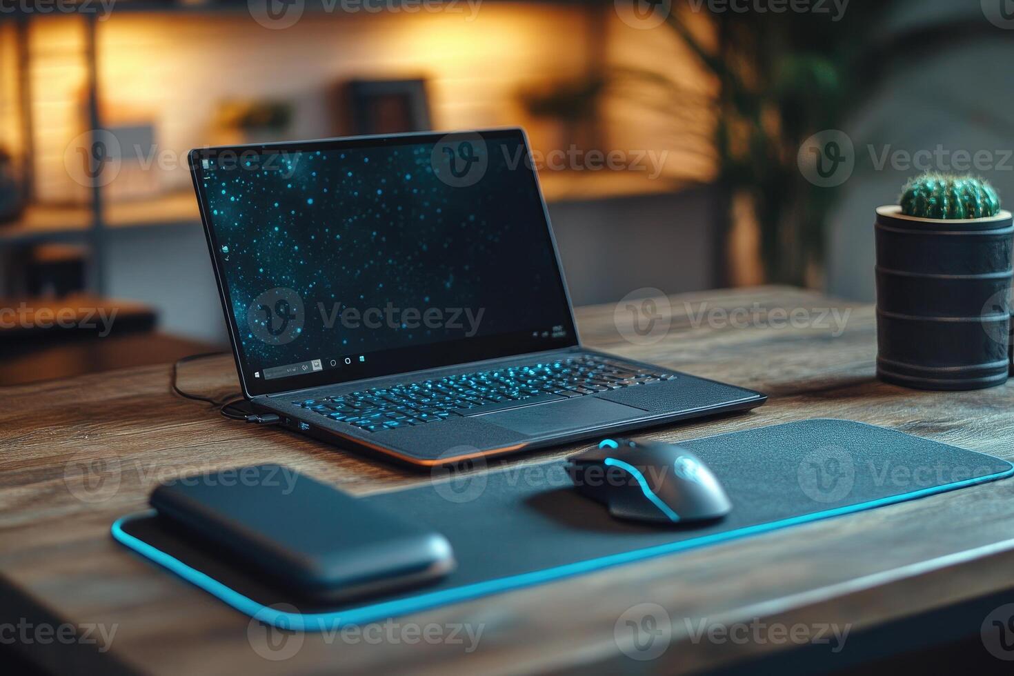 Modern laptop, gaming mouse and power bank on desk mat with rgb lighting, creating cozy gaming setup in home office photo