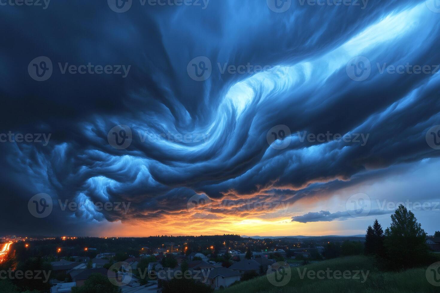 Stunning asperitas clouds swirling above suburban town at sunset photo