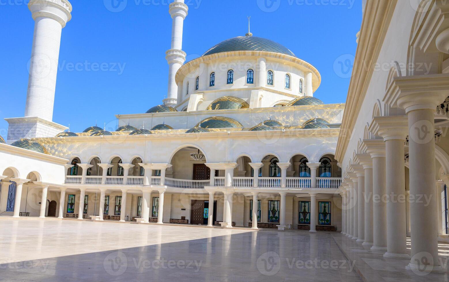 Historic courtyard of Selimiye Mosque in Northern Cyprus, with medieval stone walls and arched entrances, reflecting a unique cultural fusion. photo