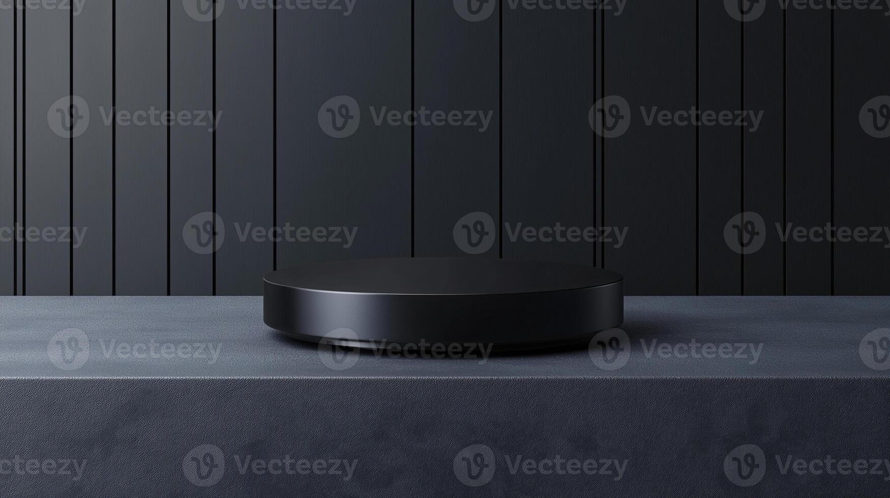A black object sits on a grey surface photo
