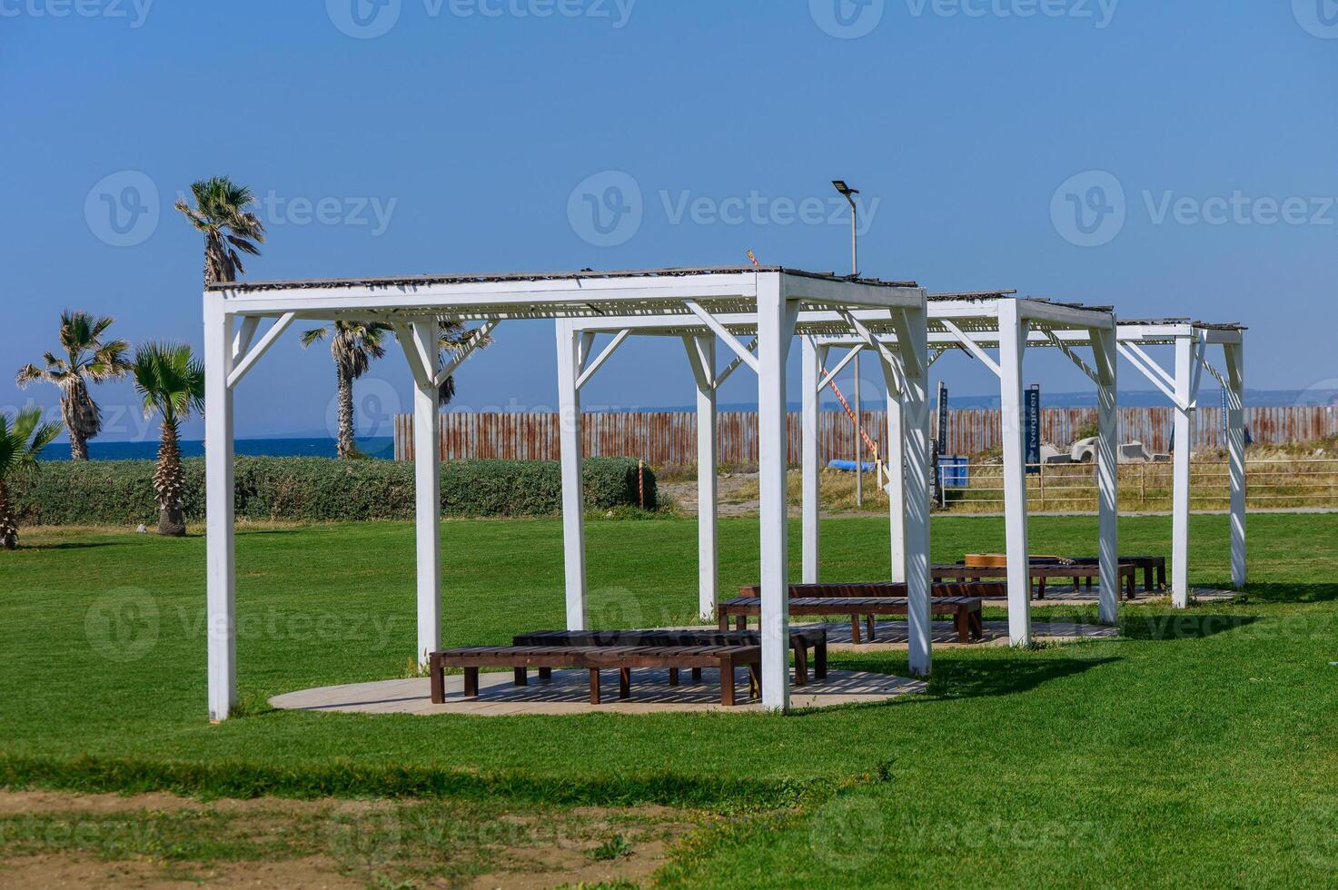 Sunshade Canopies with Beach Loungers at Resort photo