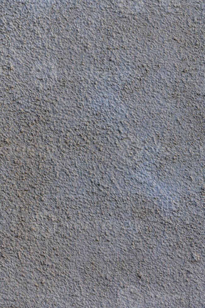 Textured neutral wall with subtle variations in tone and depth creates an abstract backdrop for artistic expression 1 photo