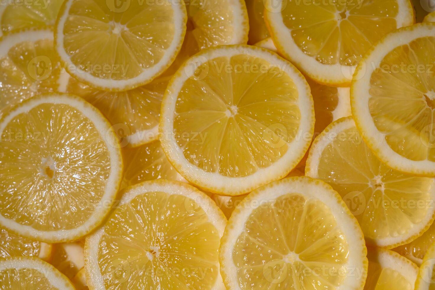 Slices of fresh lemons arranged beautifully on a bright surface capturing photo