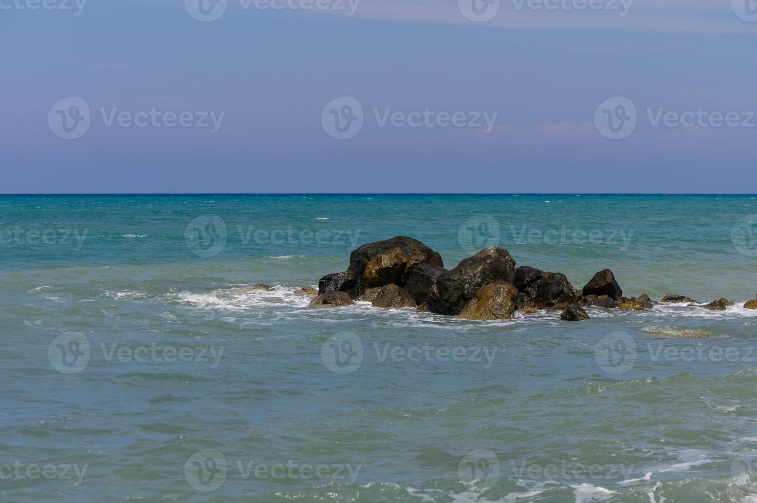 Endless horizon where the Mediterranean Sea meets the clear sky on the beautiful coast of Cyprus, a perfect vacation spot. photo