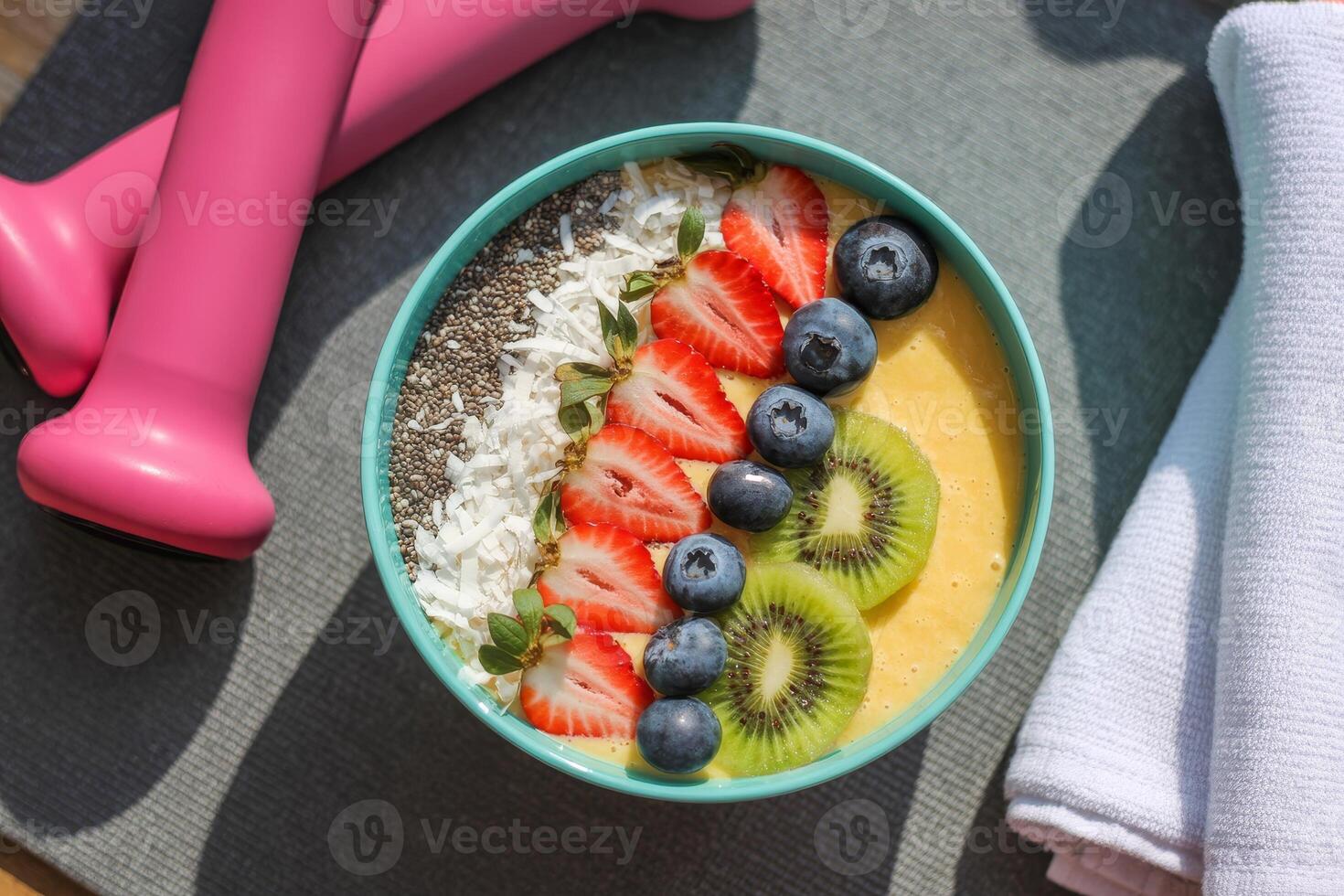 Fresh smoothie bowl topped with vibrant fruits and chia seeds, perfect for a health-conscious morning routine photo