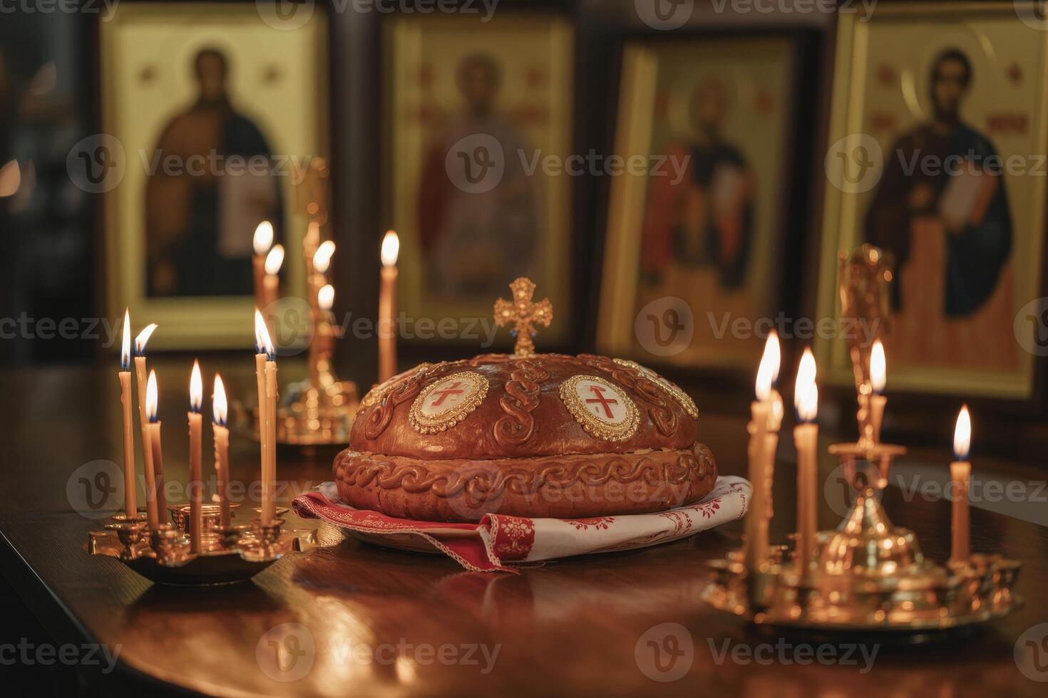 Traditional Orthodox bread centerpiece surrounded by candles and icons during a solemn religious ceremony at dusk photo