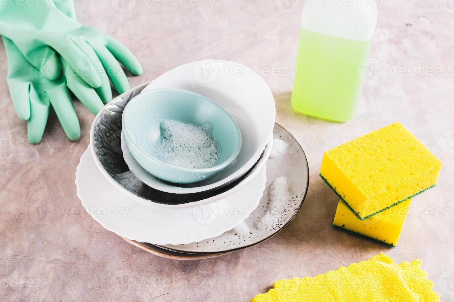 Washing dirty dishes and items for washing on the table photo