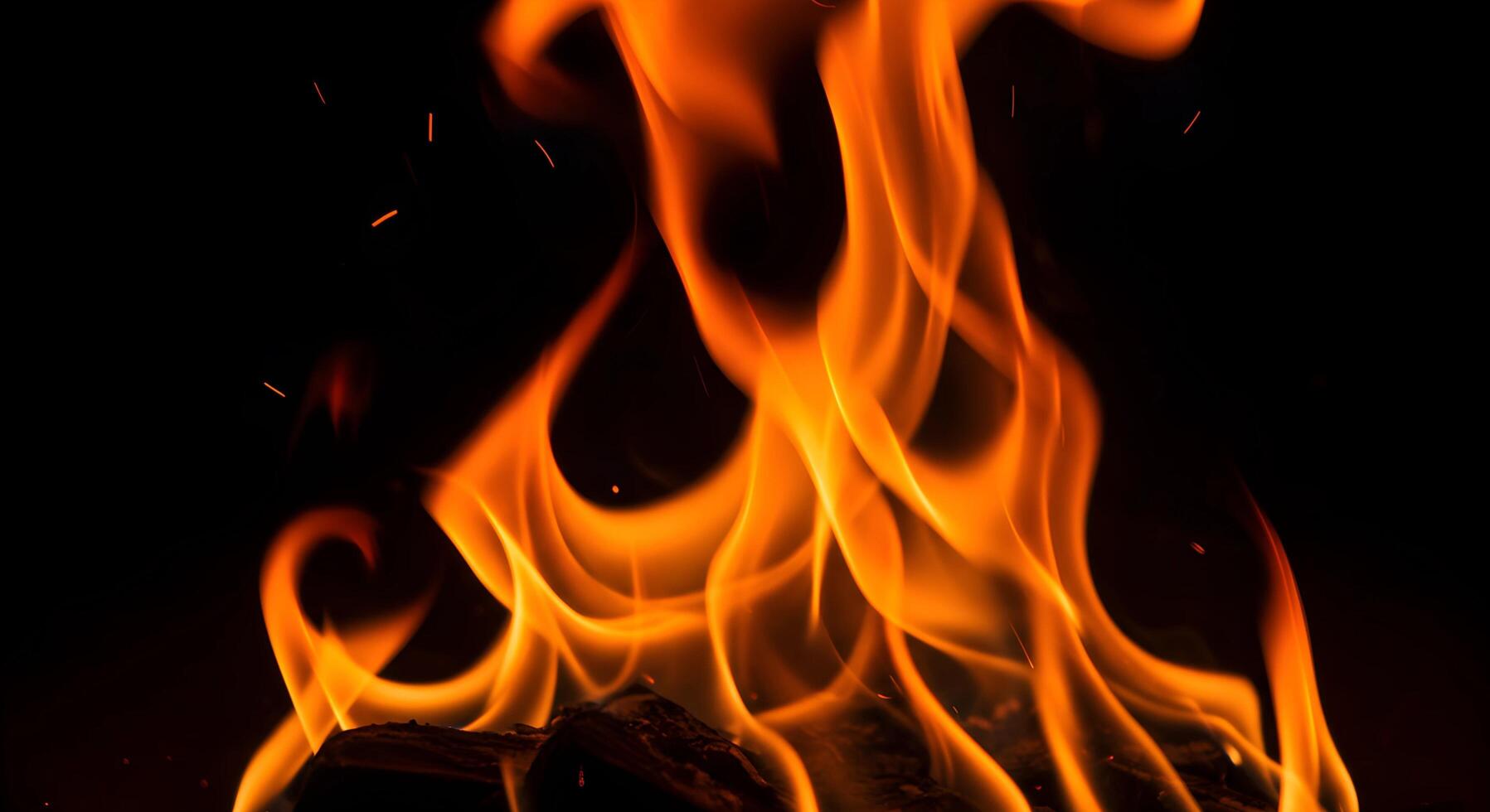 Flame Over Wood Piece in Dark Background photo