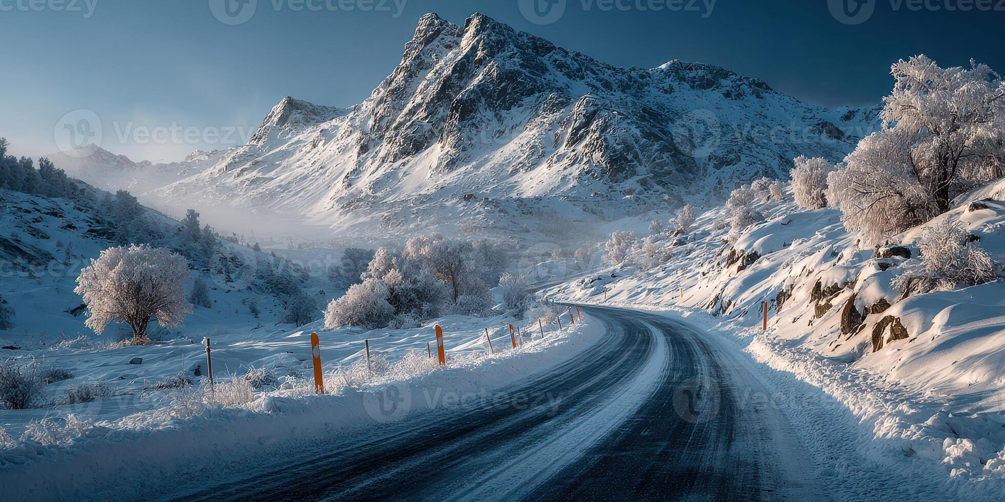 Snowy mountain road winds through a tranquil winter landscape at dawn with frost-covered trees and majestic peaks photo
