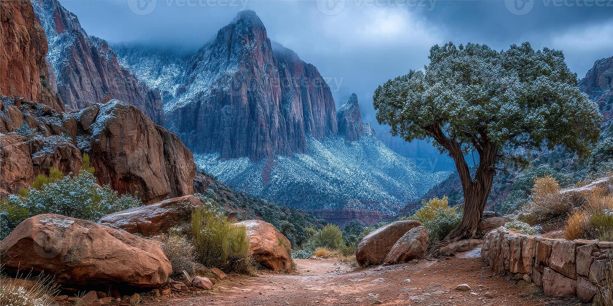 Majestic mountain landscape under a cloudy sky with snow-covered peaks in a serene national park setting photo