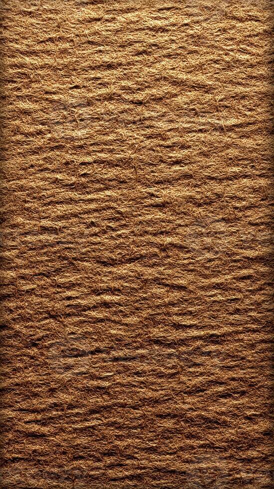 Textured natural material showcasing rustic brown fibers in a close-up view under soft lighting, ideal for backgrounds or crafts photo