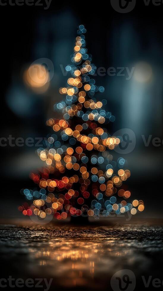 Colorful Christmas tree with lights glowing in the evening, creating a festive atmosphere during the winter season photo
