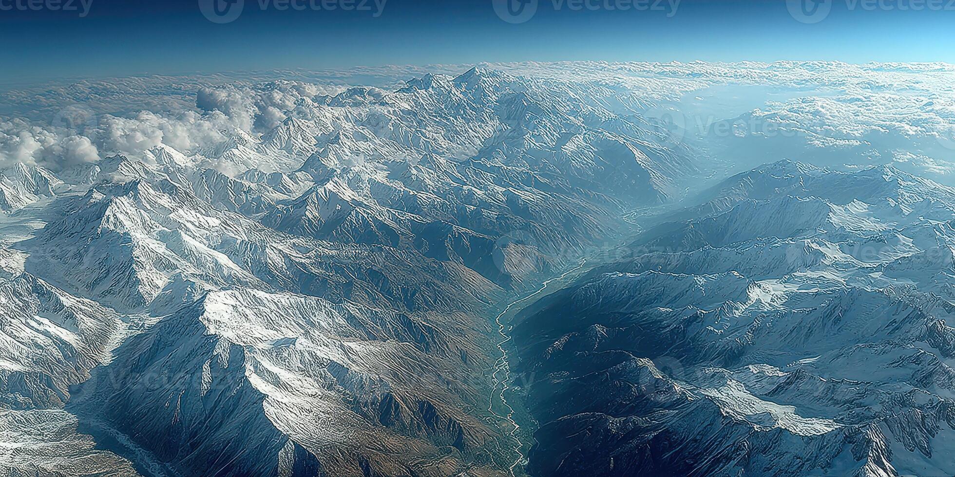 Majestic mountain range under cloudy sky with river flowing through valley at sunrise in the Himalayas photo