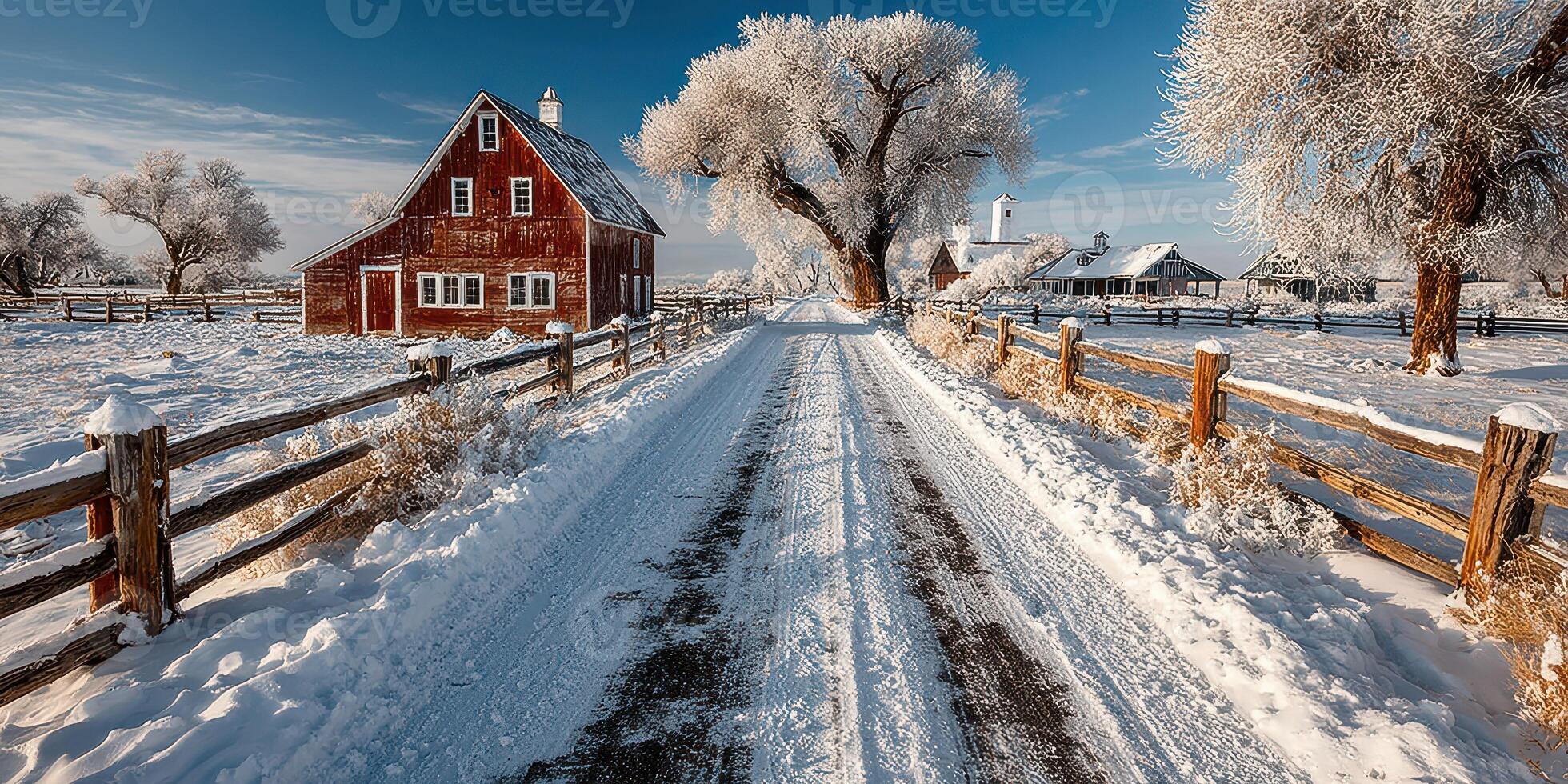 Snow-covered rural landscape with rustic barn and frosty trees during a clear winter day photo