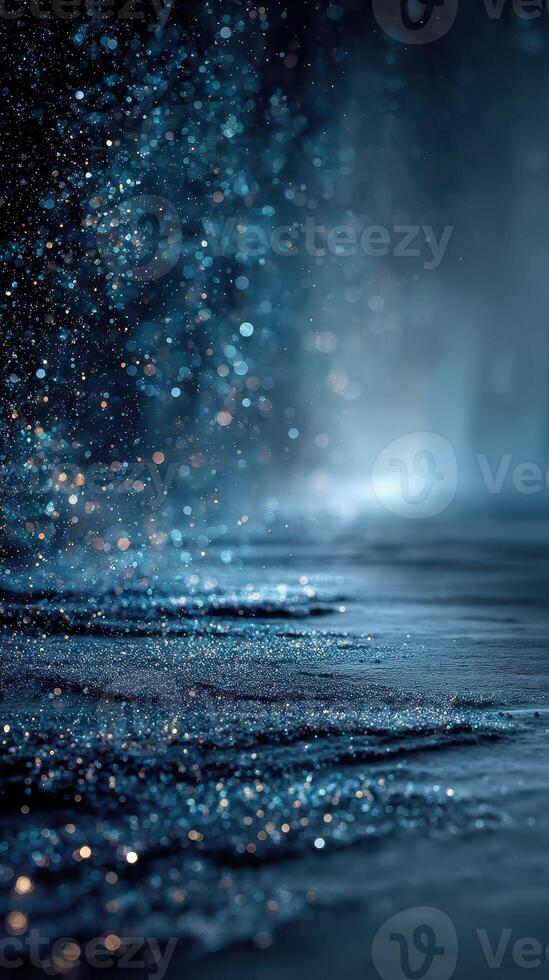 Water droplets glisten in the darkness creating an ethereal atmosphere of light and color photo
