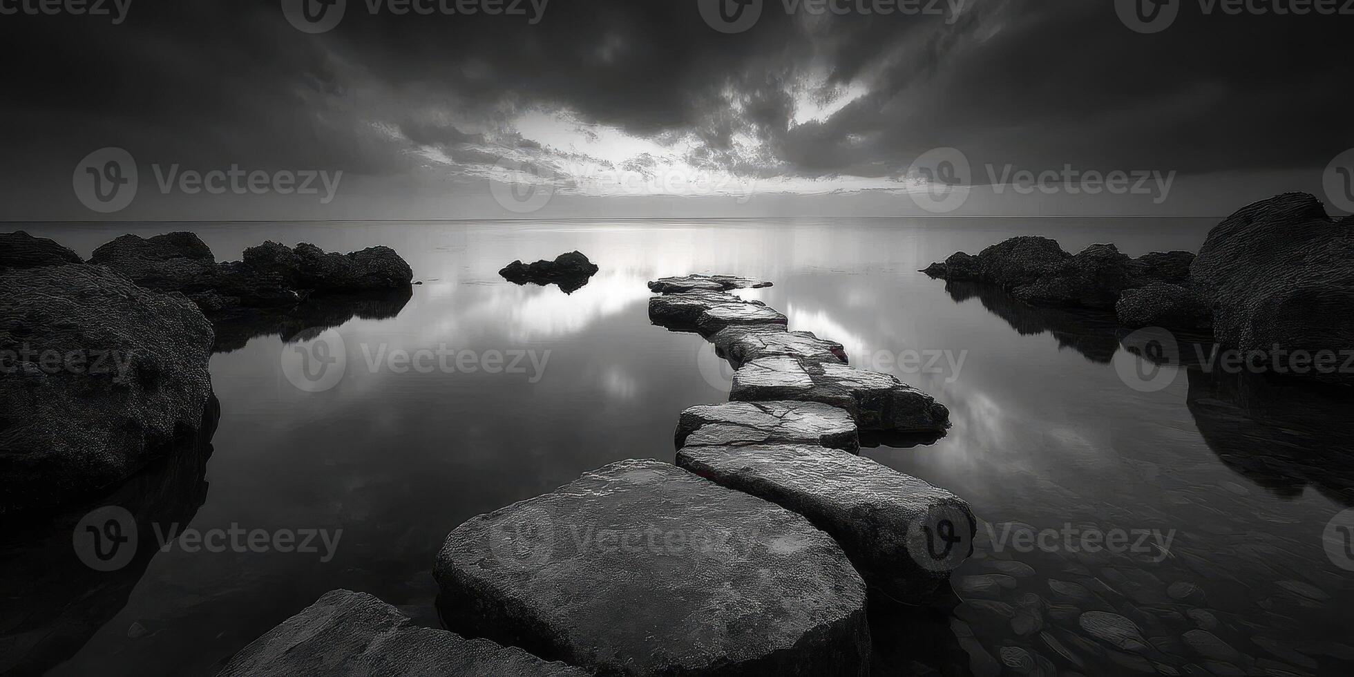 Stones create a path across still water under dark clouds at sunset photo