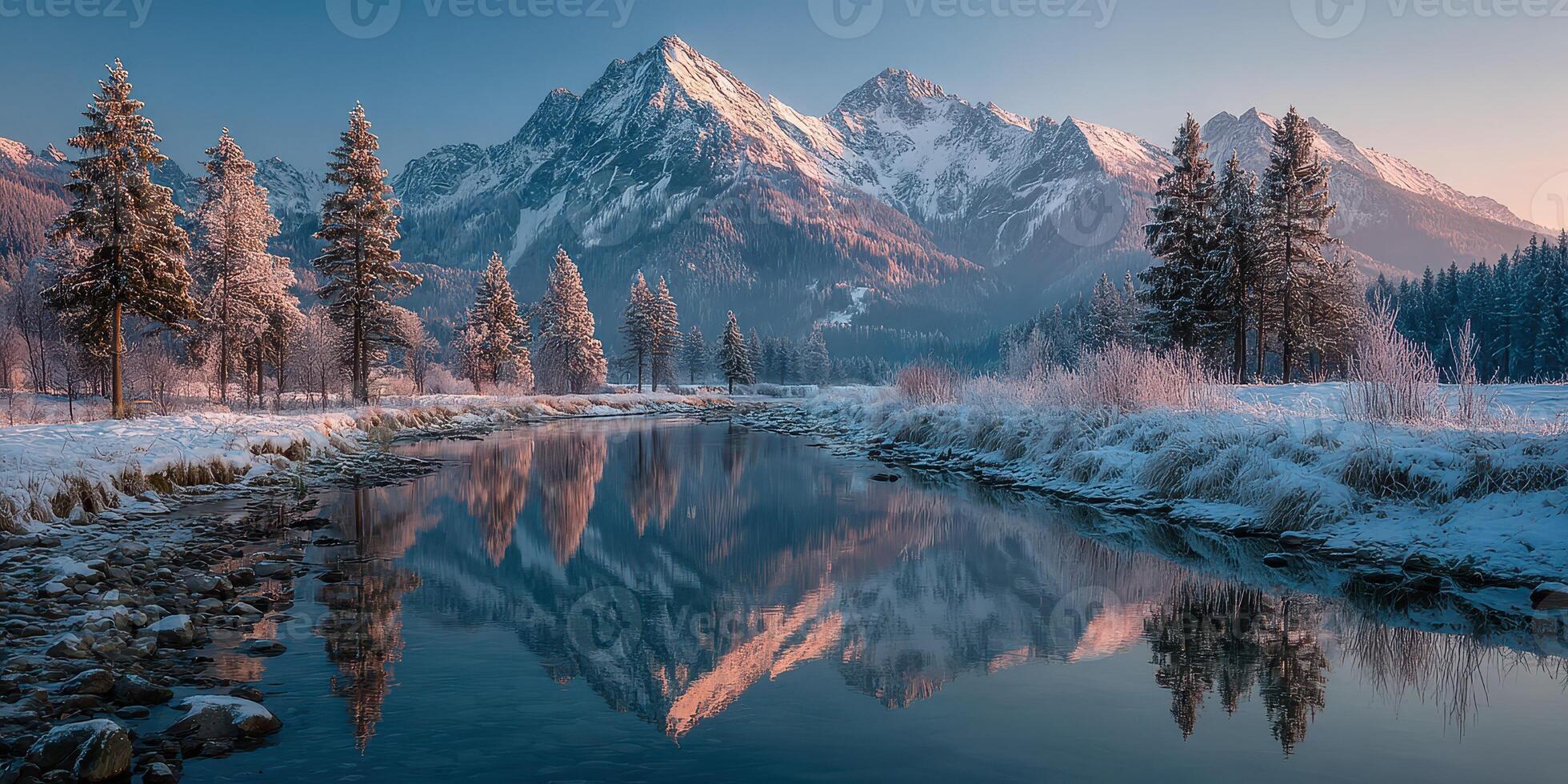Breathtaking winter landscape with snow-capped mountains and tranquil river reflecting the scenery during twilight photo