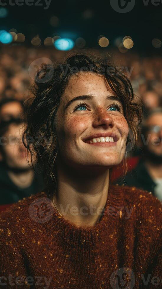 Audience enjoys live performance with joyful expressions under bright lights photo