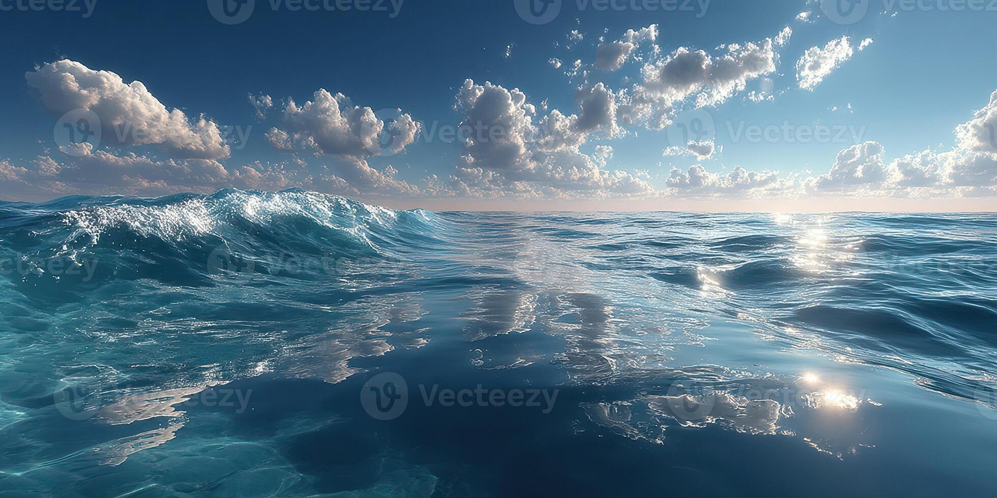 Waves gently lap against the serene surface of the ocean under a bright, clear sky with scattered clouds at midday photo