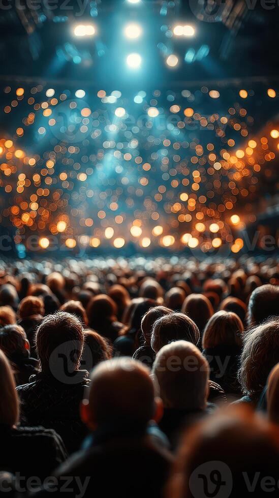 Concert audience immersed in vibrant lights and energy at a live music event in the evening photo
