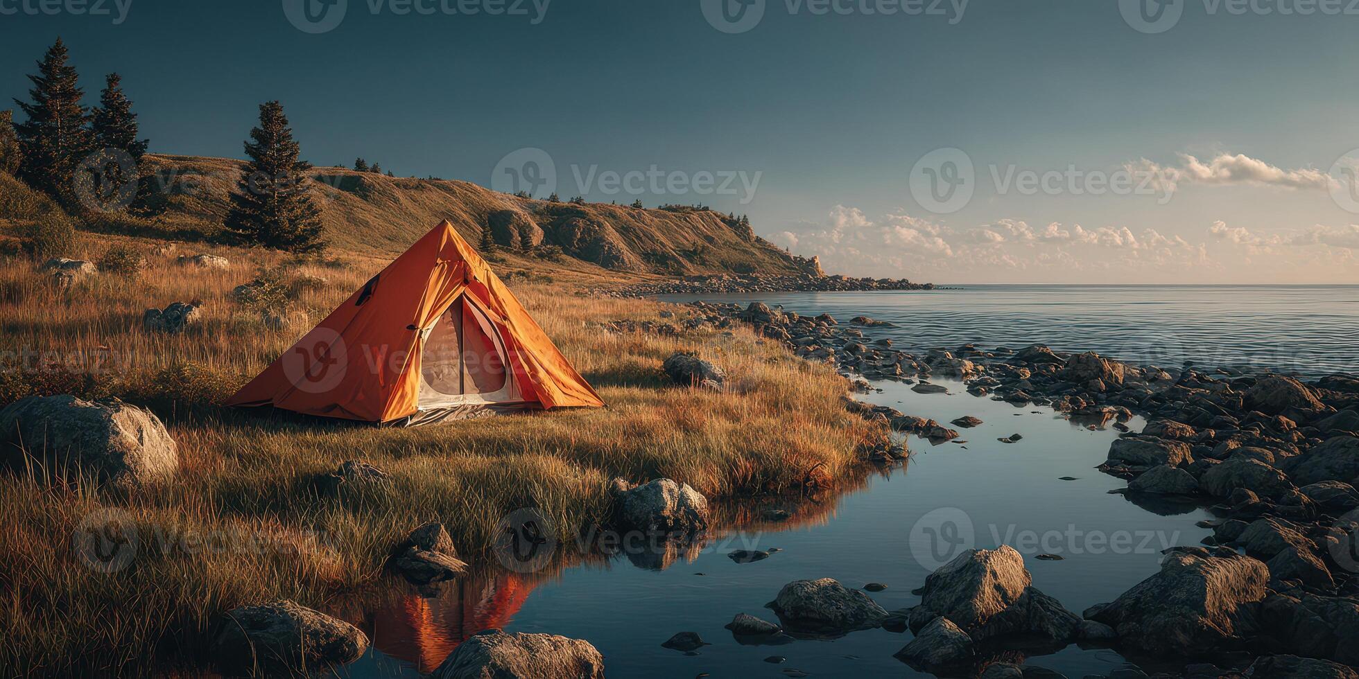 Bright orange tent set up by a tranquil lake during a golden hour in a scenic nature landscape photo