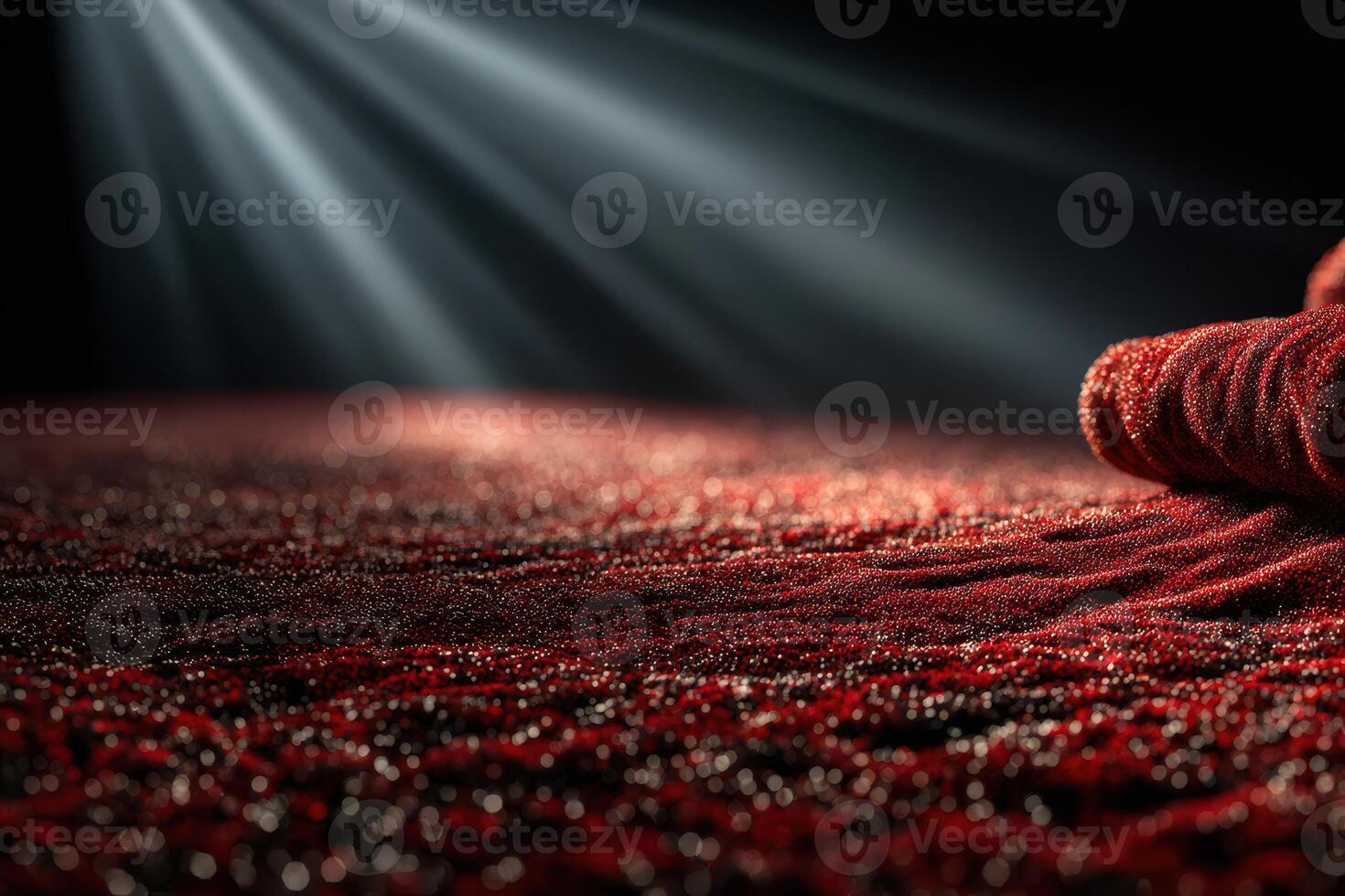 Close-up of shimmering red fabric illuminated by soft light creating a dramatic atmosphere for fashion or artistic purposes photo