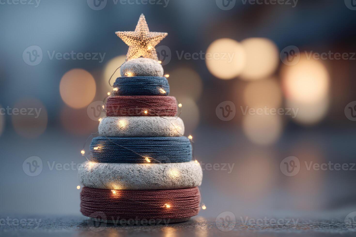 Unique decorative Christmas tree made of fabric rolls with star topper and string lights in soft evening light photo