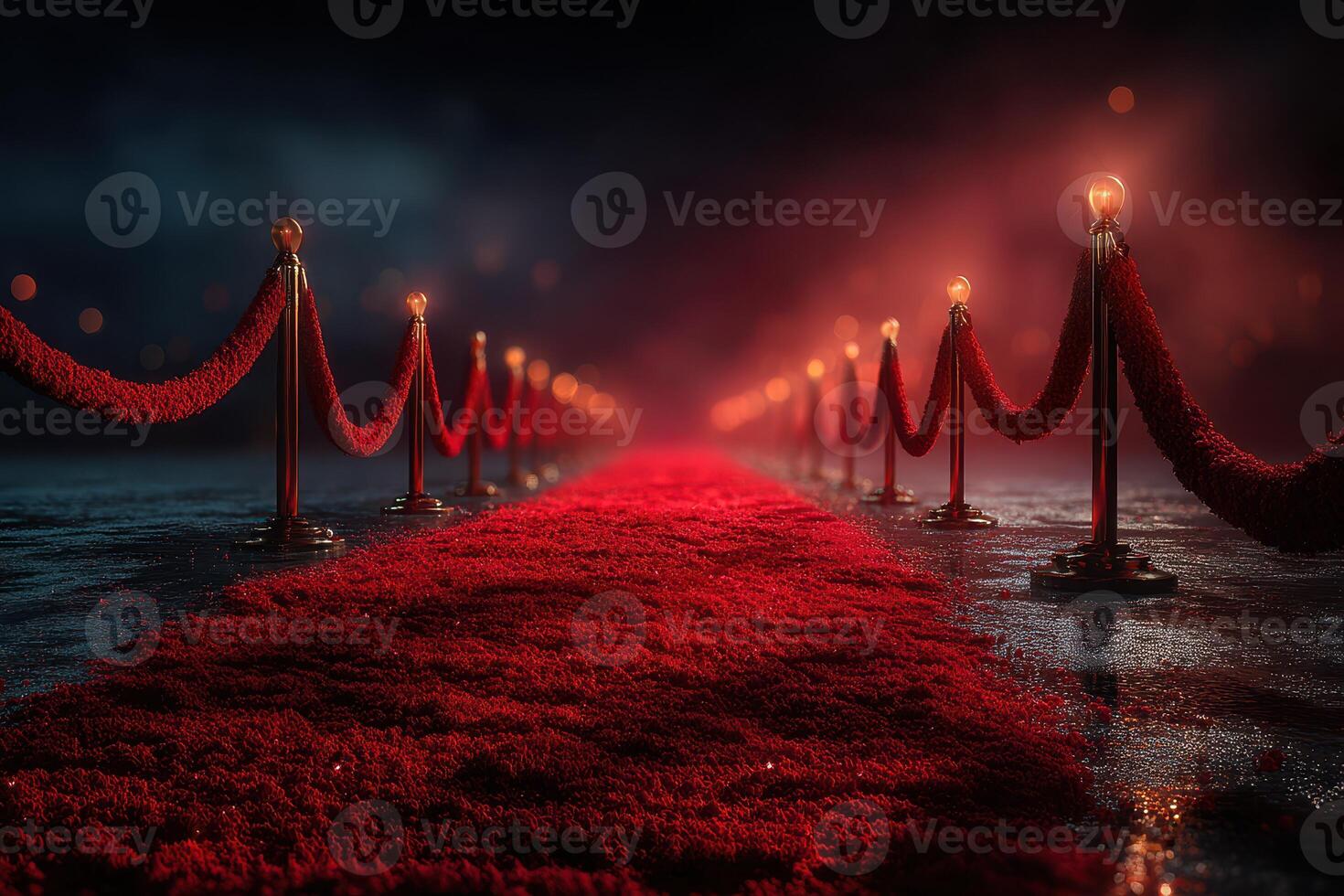 Red carpet leading to an exclusive event venue at night illuminated by glowing lights and surrounded by velvet ropes photo