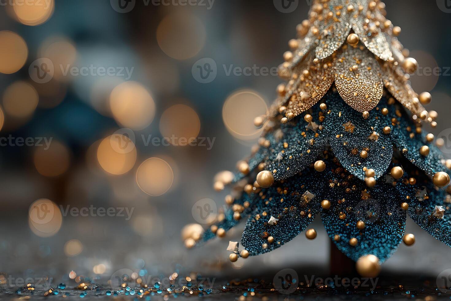 Glittering blue and gold Christmas tree decoration shining in soft festive lights during the holiday season photo