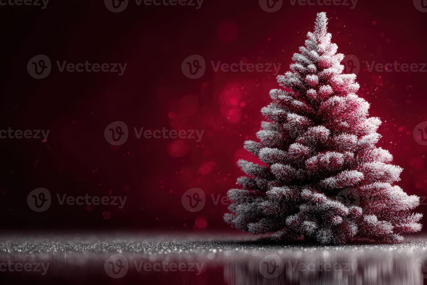 Festive Christmas tree adorned with frost against a vibrant red background creating a joyful holiday atmosphere photo