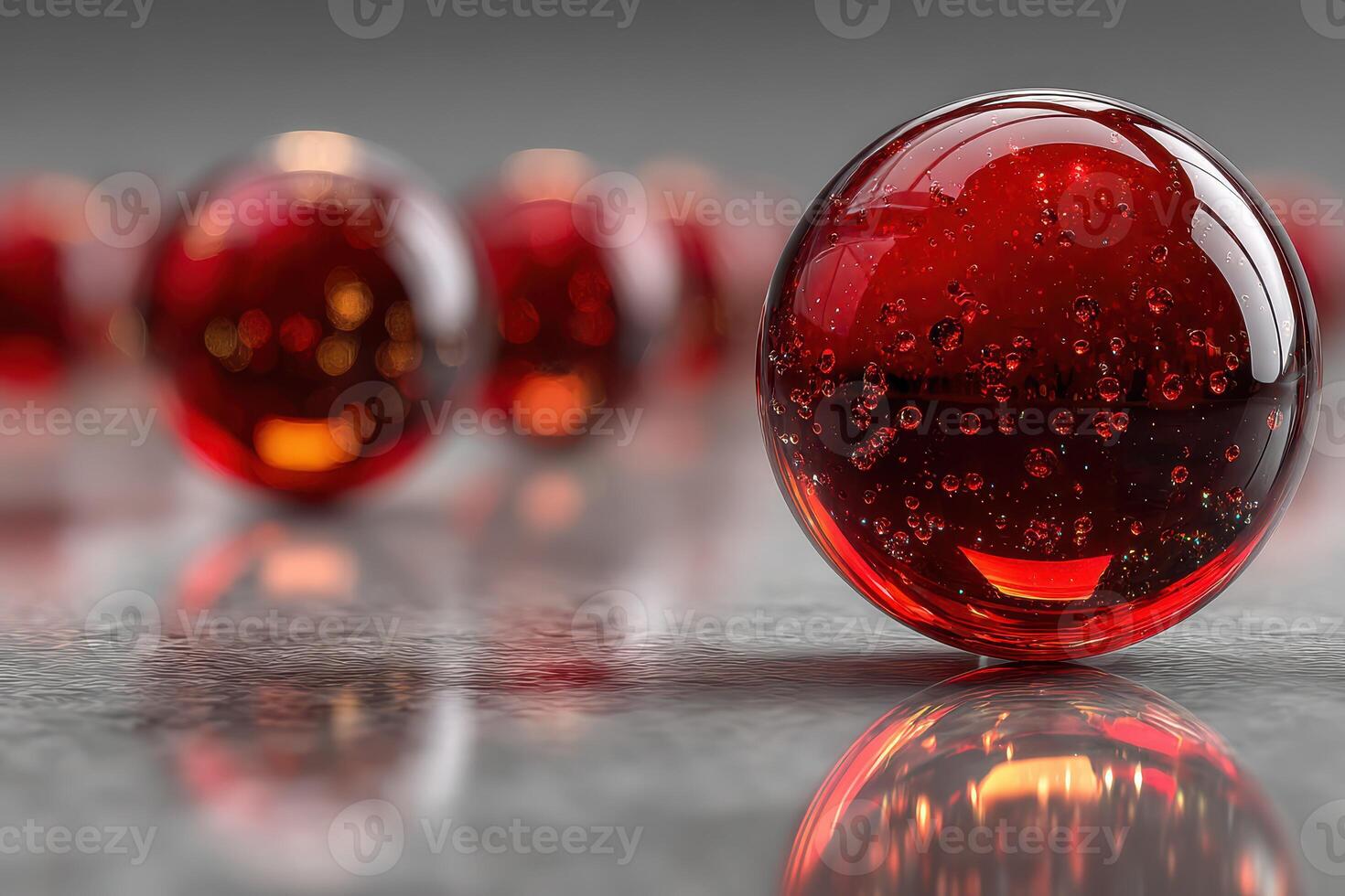 Red glass spheres reflecting light on a smooth surface in an artistic composition photo