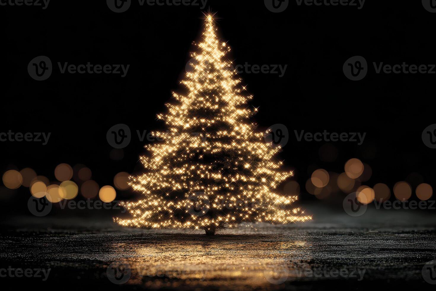 Twinkling Christmas tree adorned with lights in a dark setting during festive season photo