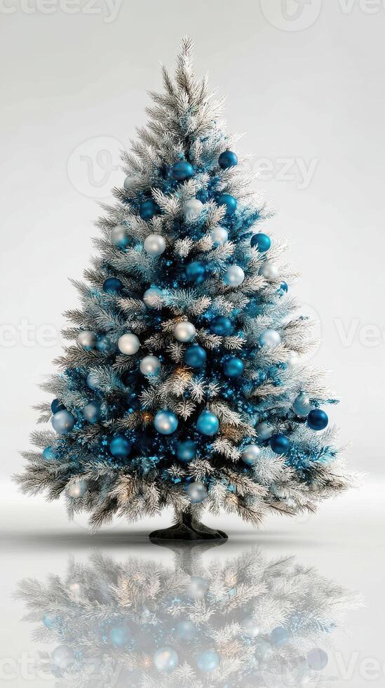 Decorated Christmas tree with blue and silver ornaments showcasing festive spirit in a bright indoor setting photo