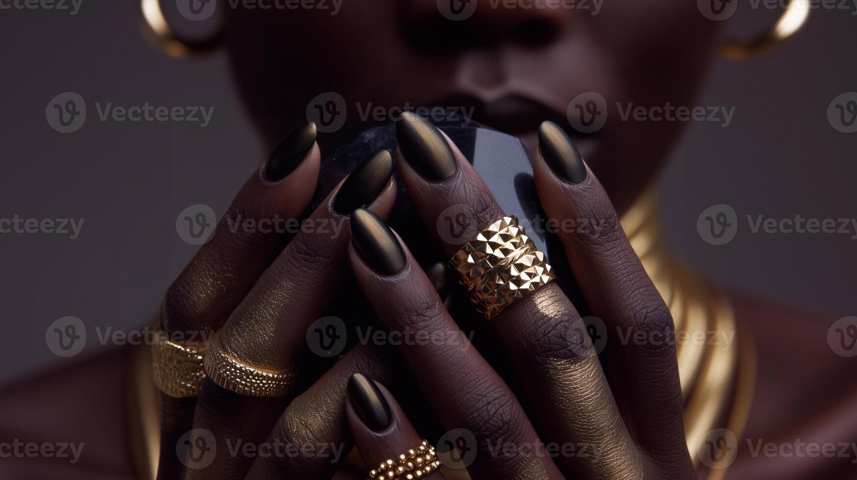 Elegant dark skin with matte black nails and gold rings, stylish manicure and luxurious accessories in golden tones, modern beauty and fashion aesthetic. photo