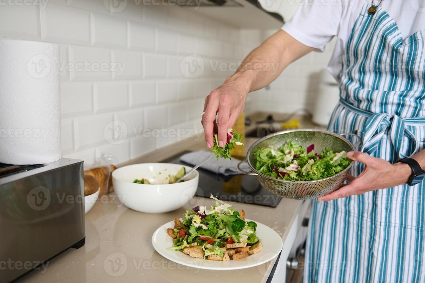Cooking Healthy Salad in a Modern Kitchen With Fresh Ingredients photo