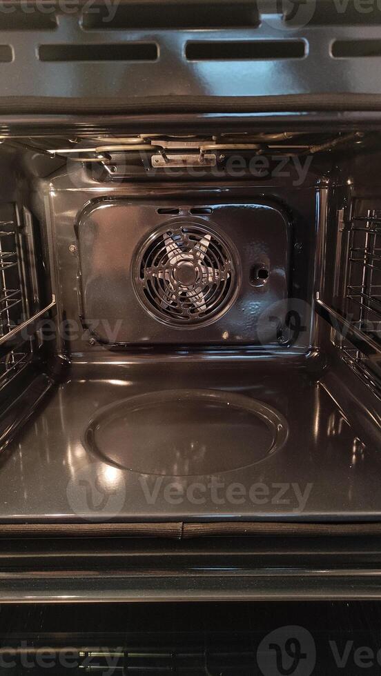 Empty convection oven with fan and racks displaying cooking potential photo