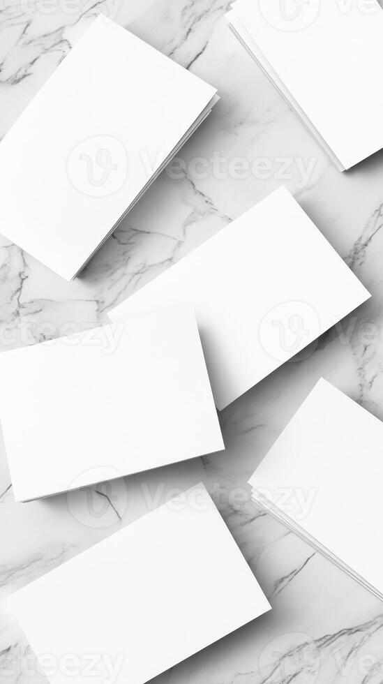 White Blank Business Cards Scattered on a Marbled Surface with Soft Lighting photo