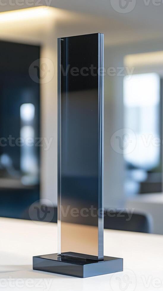 Sleek Black Glass Structure Standing On White Table In Minimalist Design photo