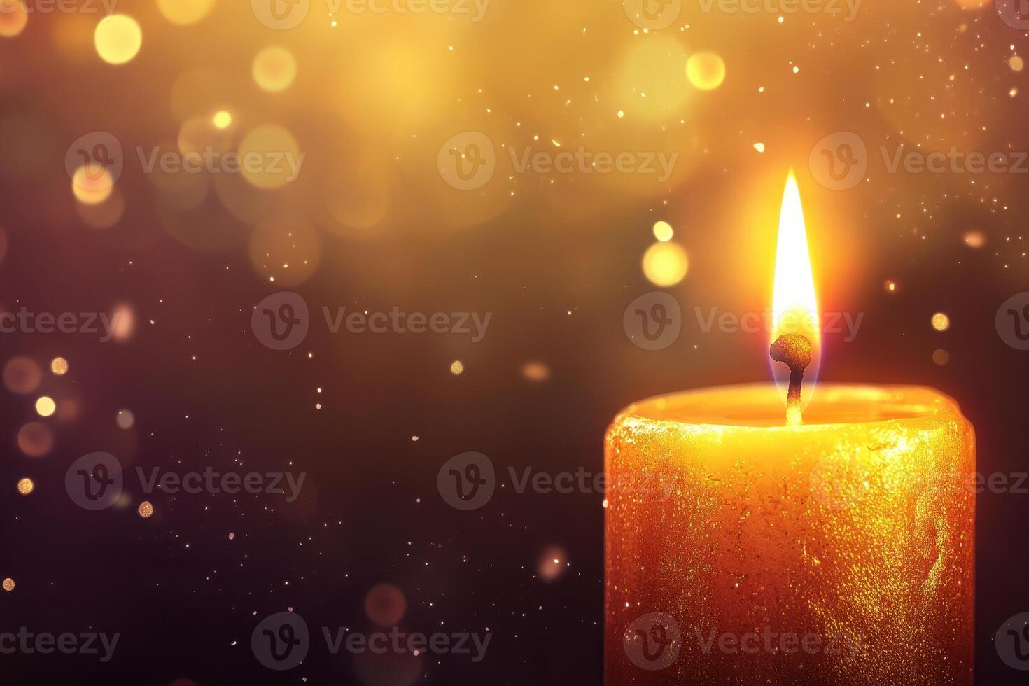 Golden Candlelight Glowing Brightly Against A Dark Background photo