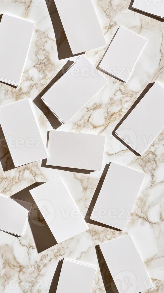 Scattered White Cards on Marble Surface Casting Shadows Creating Geometric Pattern for Abstract Background photo