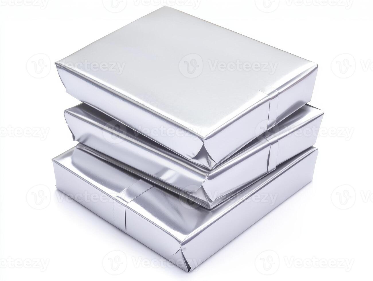 Stacked Silver Metallic Gift Boxes On White Background Reflecting Light With Geometric Shapes photo