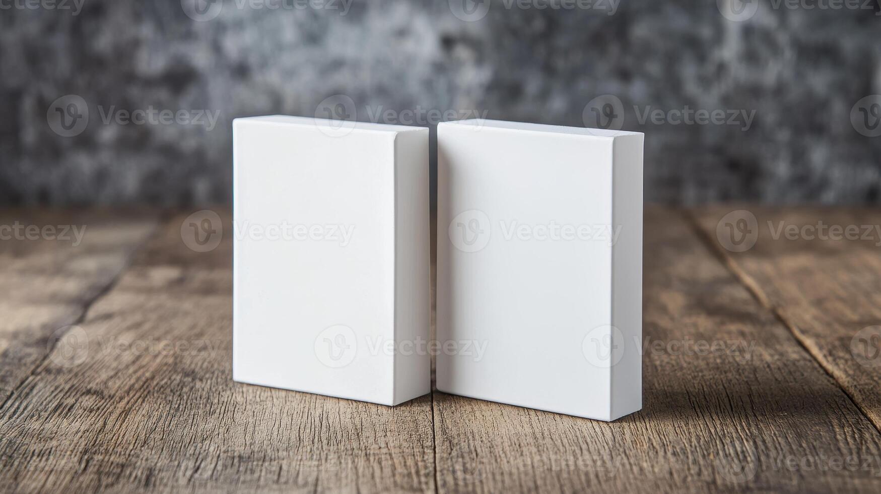 Two White Rectangular Objects On Textured Wooden Surface Against Gray Background photo