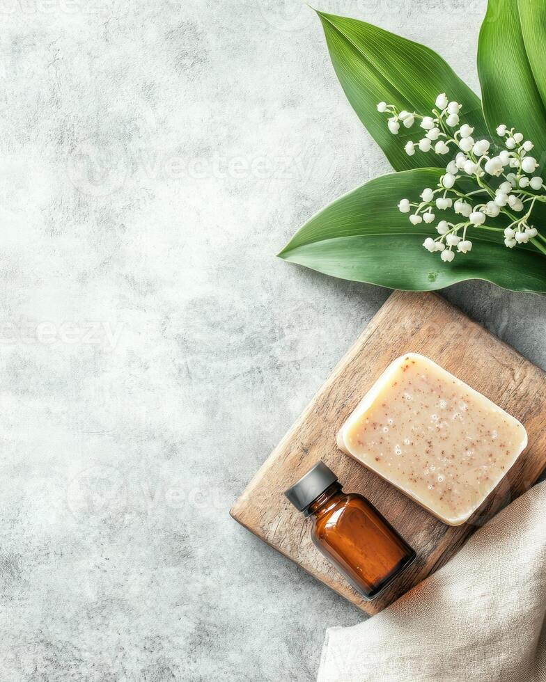 Lily of the Valley Flowers with Soap and Essential Oil in Spa Setting photo
