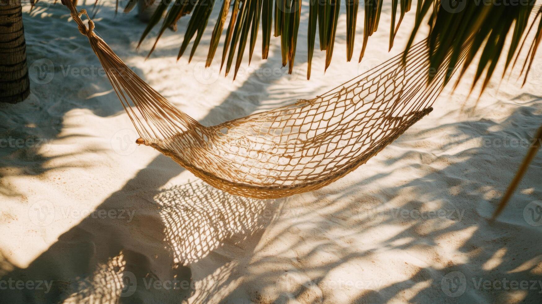 Beige Hammock on Tropical Beach Under Palm Tree photo