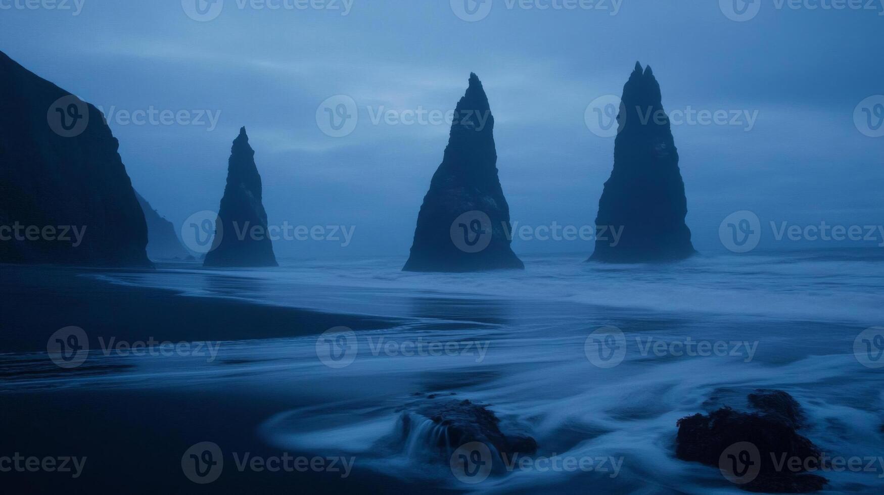 Dark Blue Ocean Waves Crashing Against Rugged Rock Formations on Coast photo
