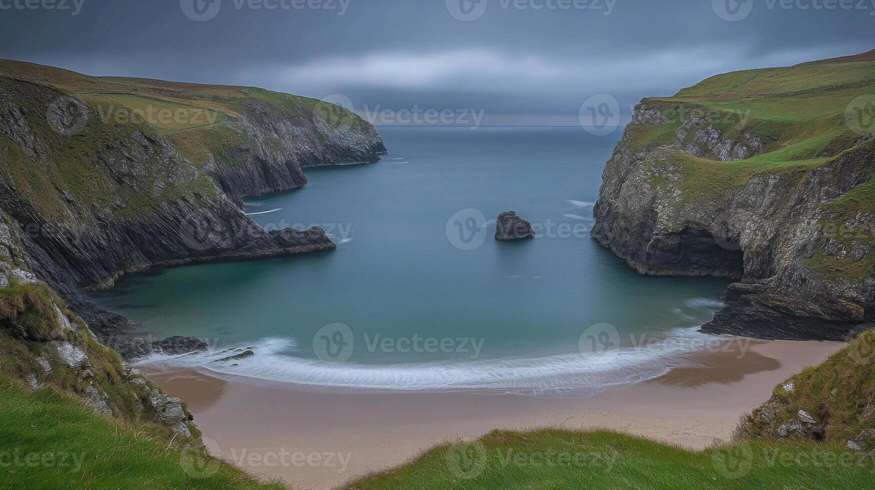Serene Coastal Bay With Sandy Beach And Dramatic Cliffs photo