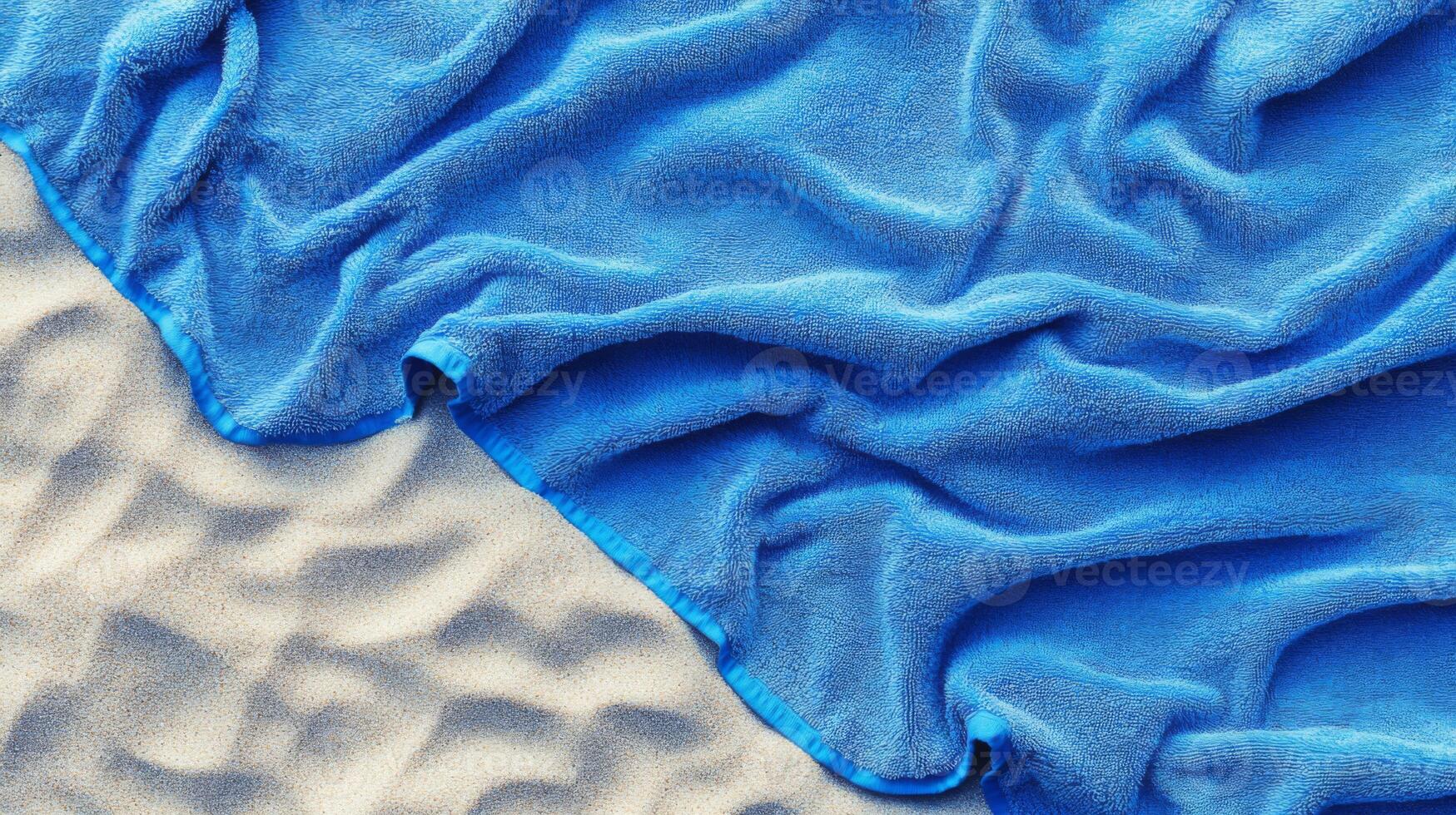 Blue Beach Towel on Sand photo