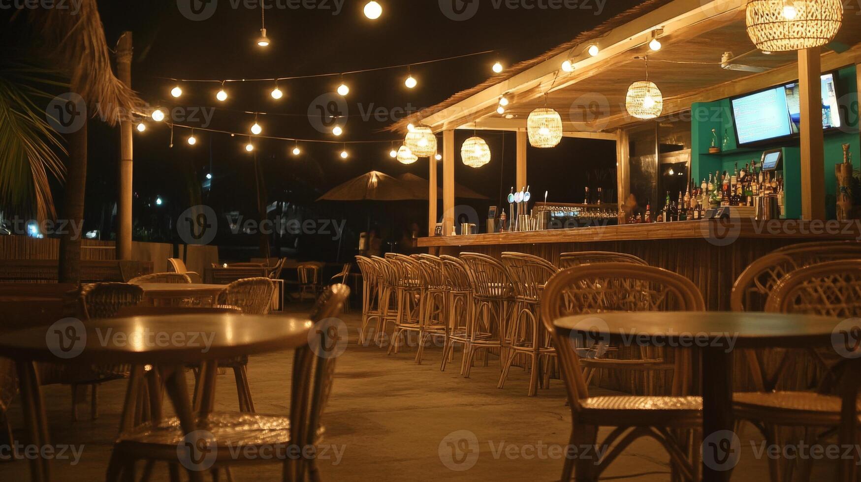 Nighttime Tropical Bar Patio with String Lights photo